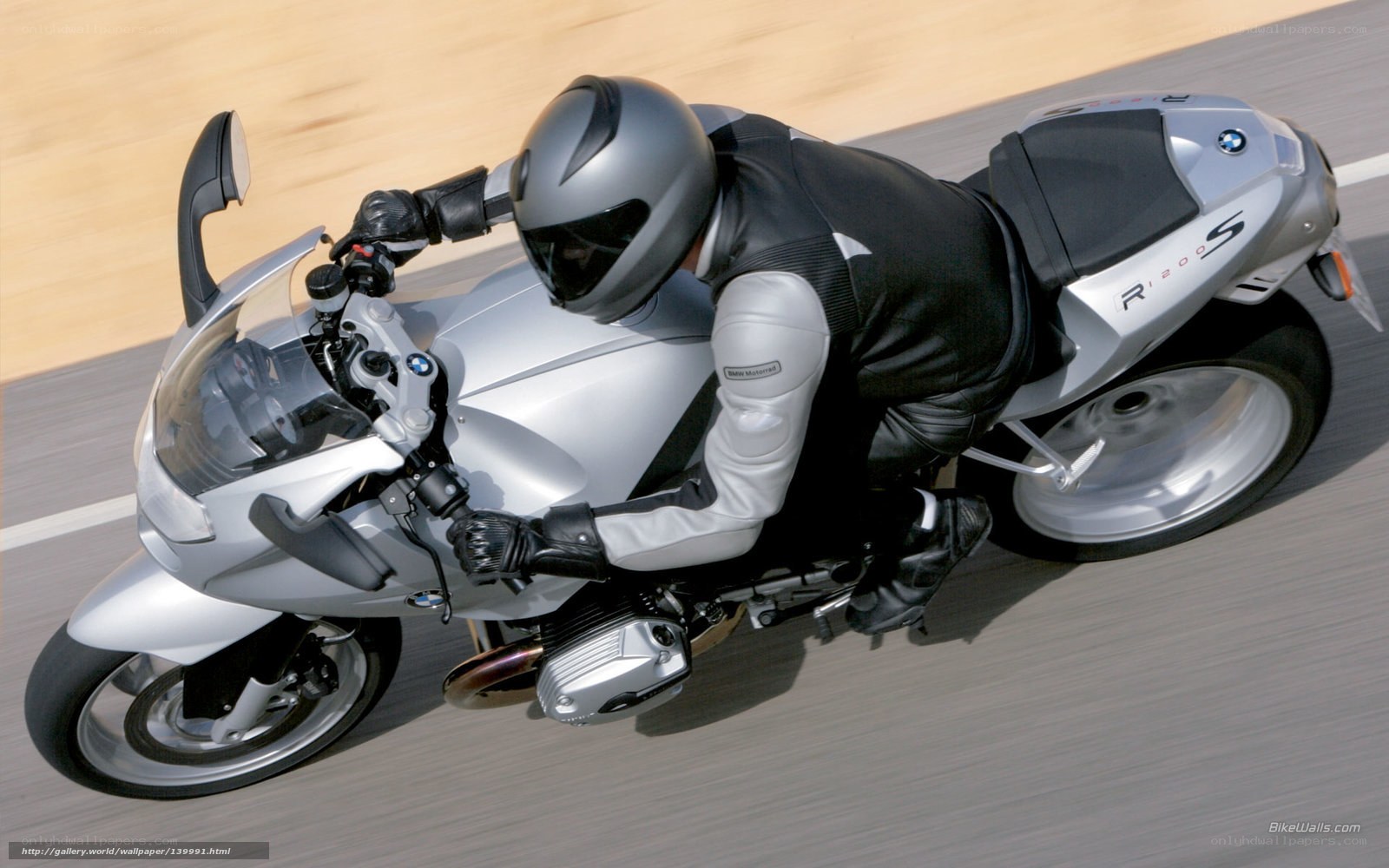 rider on silver bmw motorcycle