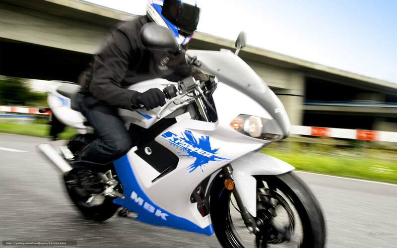 rider on white and blue motorcycle