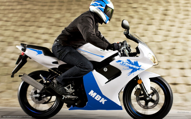 rider on white and blue motorcycle