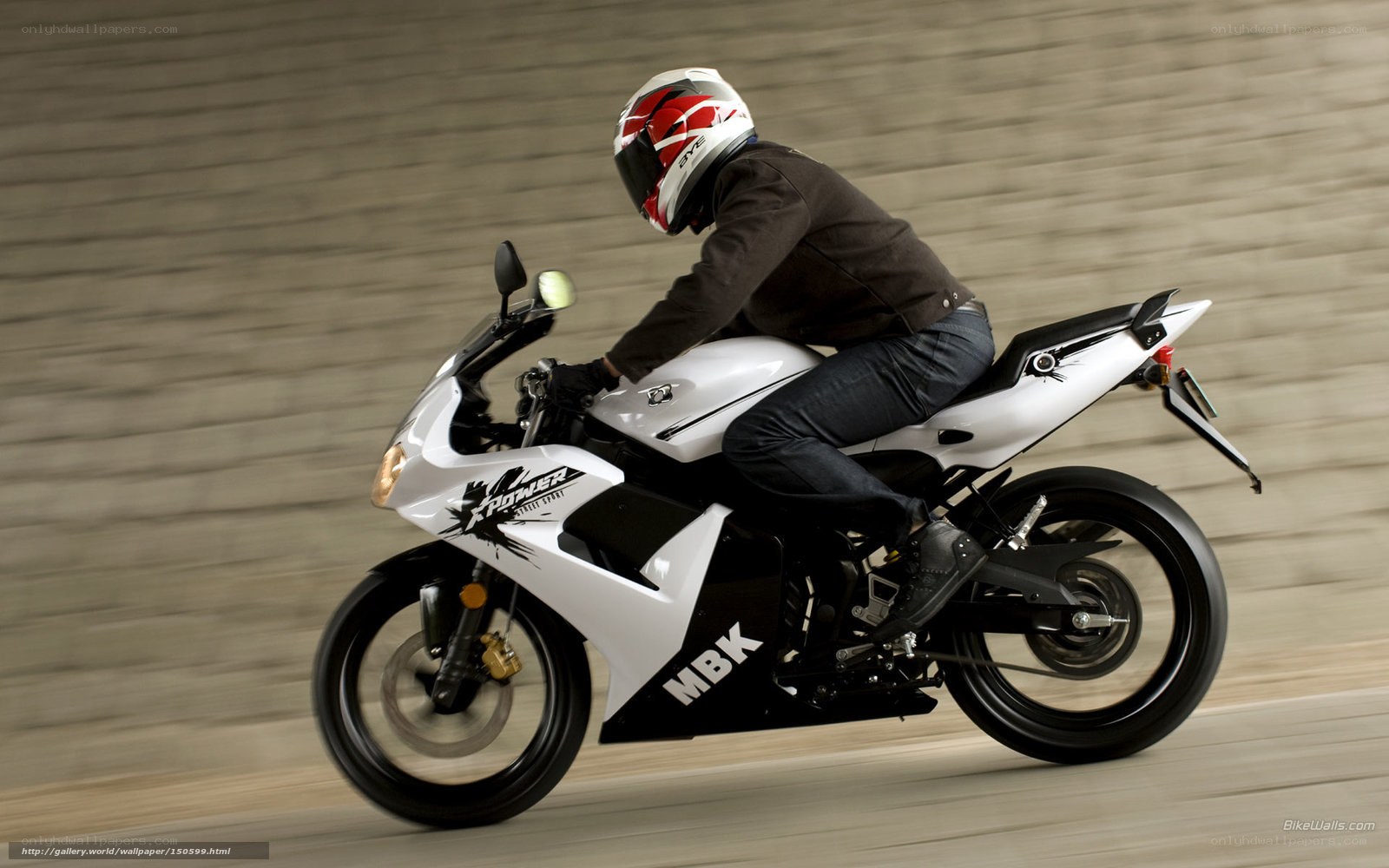 rider on white sport motorcycle