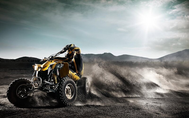 Rider on Yellow ATV — Dramatic