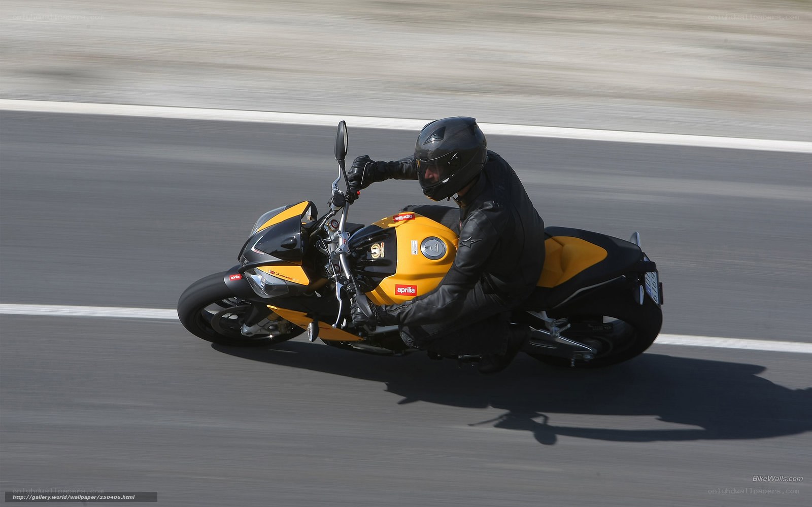 rider on yellow motorcycle