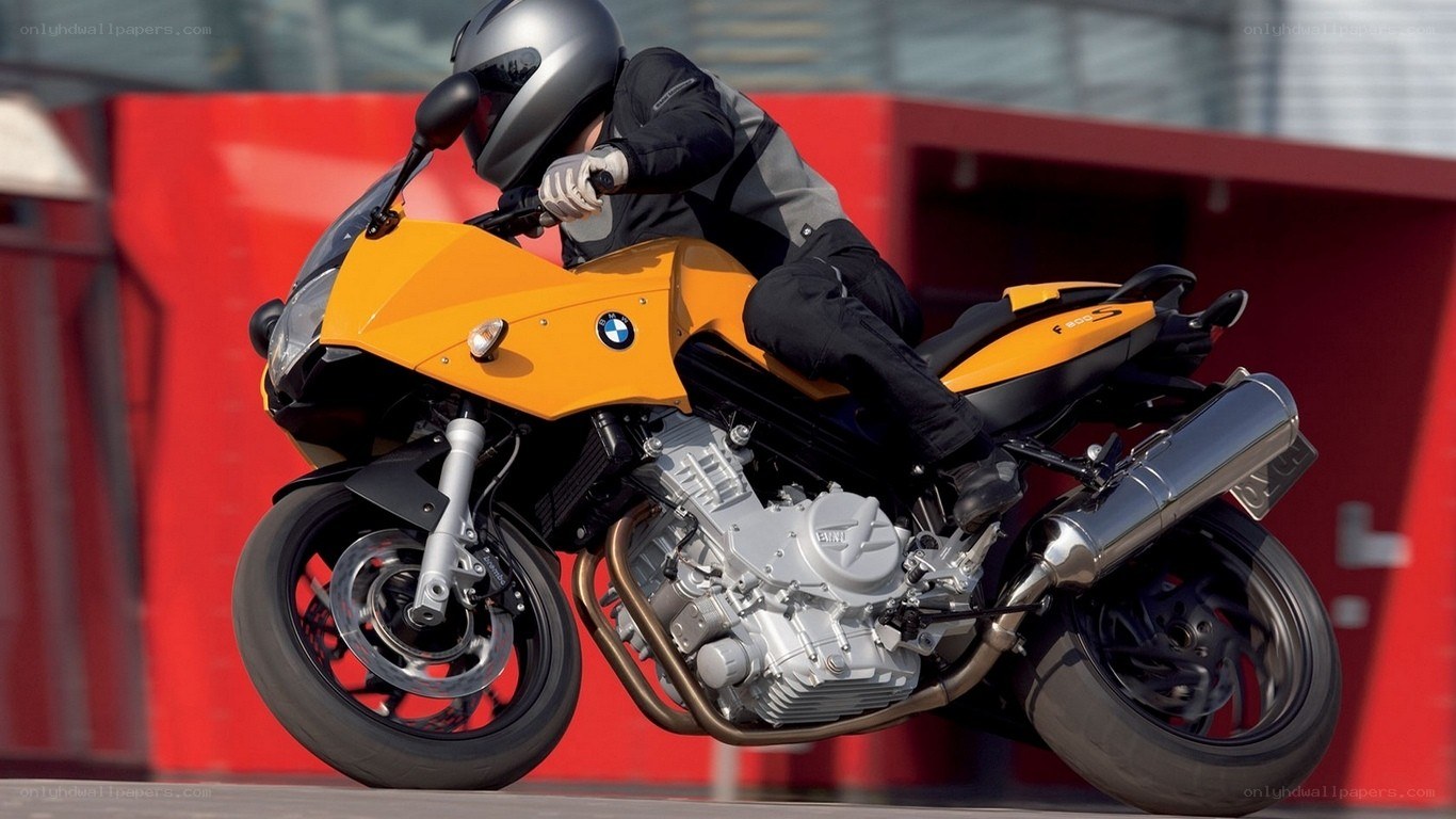 rider on yellow motorcycle