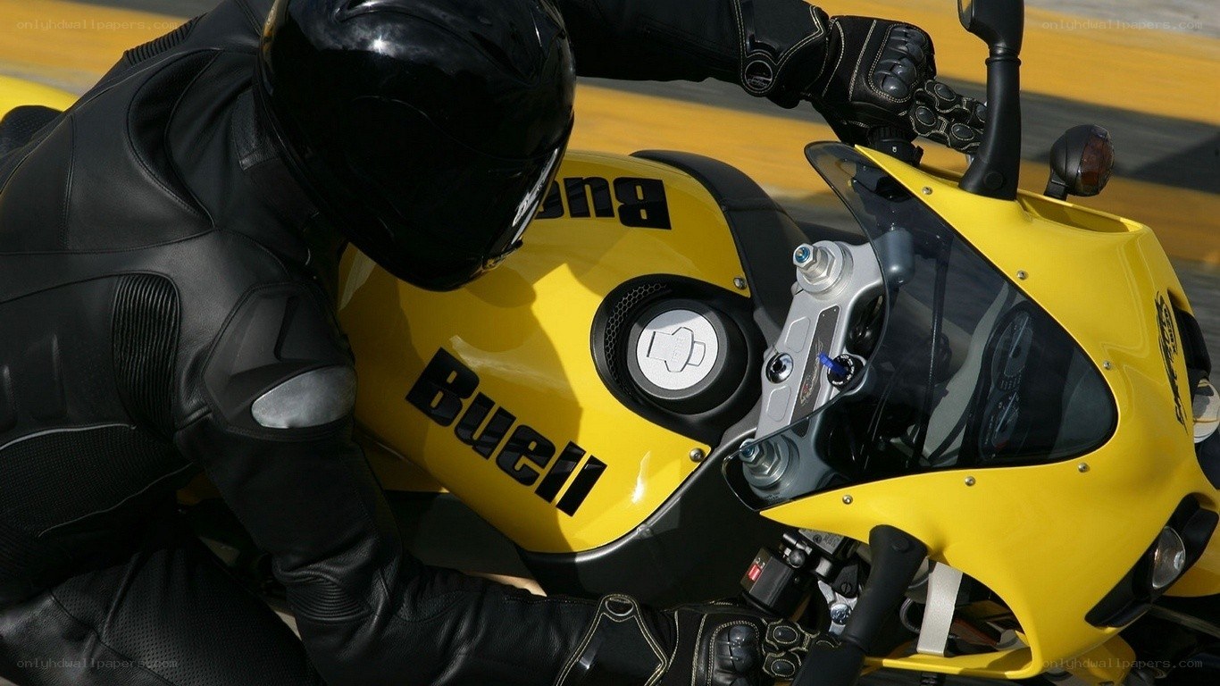 rider on yellow motorcycle