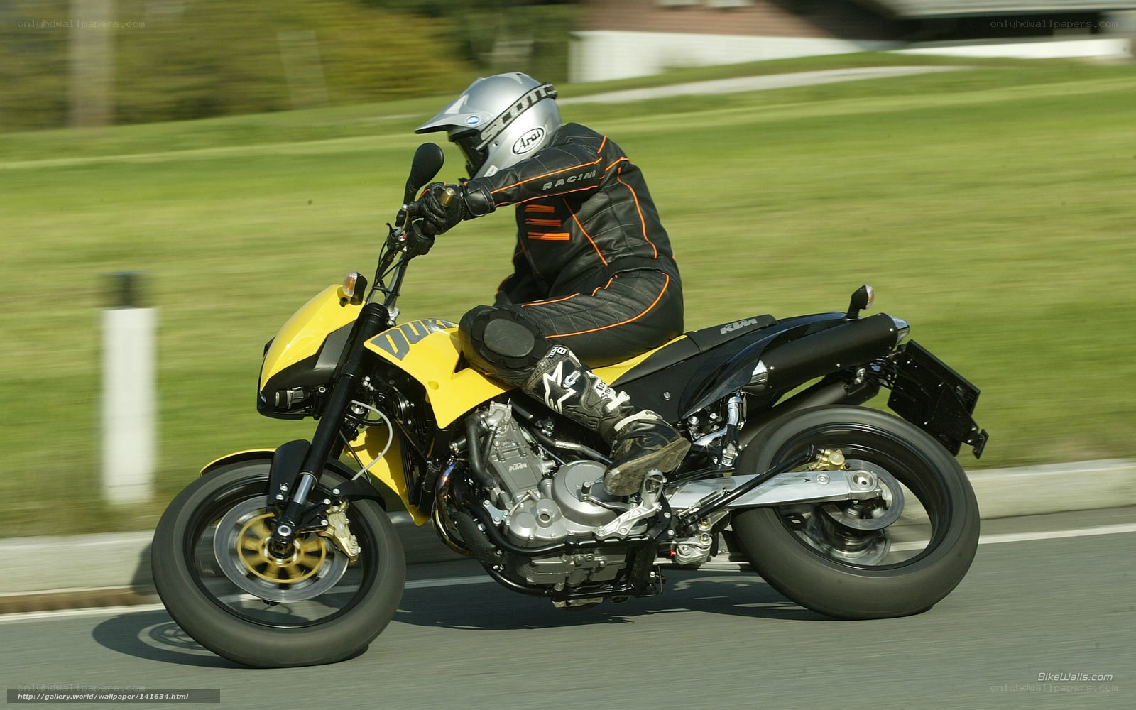 rider on yellow motorcycle