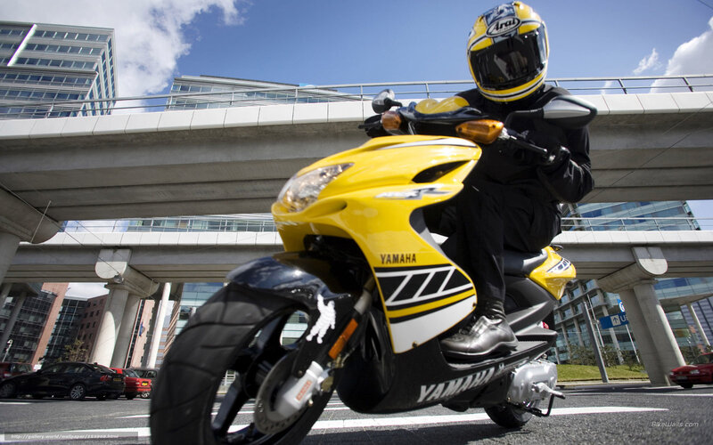 Rider on yellow scooter