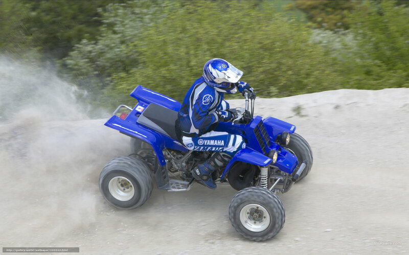 Riding a blue ATV
