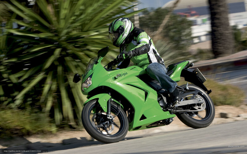 Riding a green motorcycle