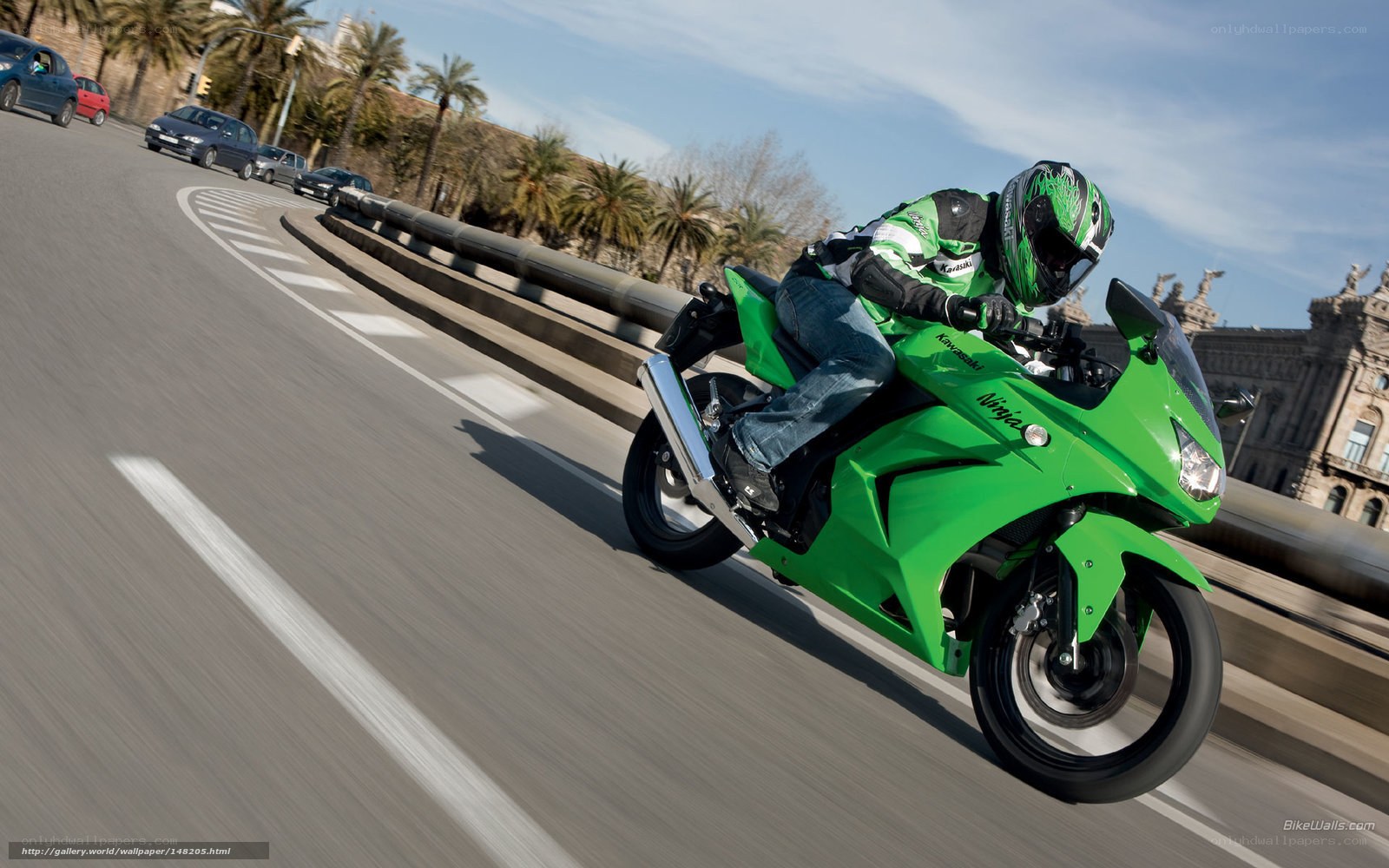 Riding a green motorcycle on a bridge
