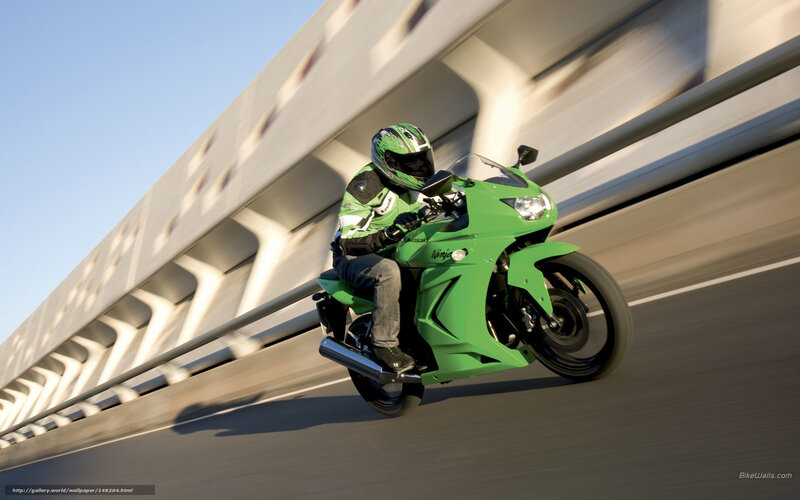Riding a green motorcycle