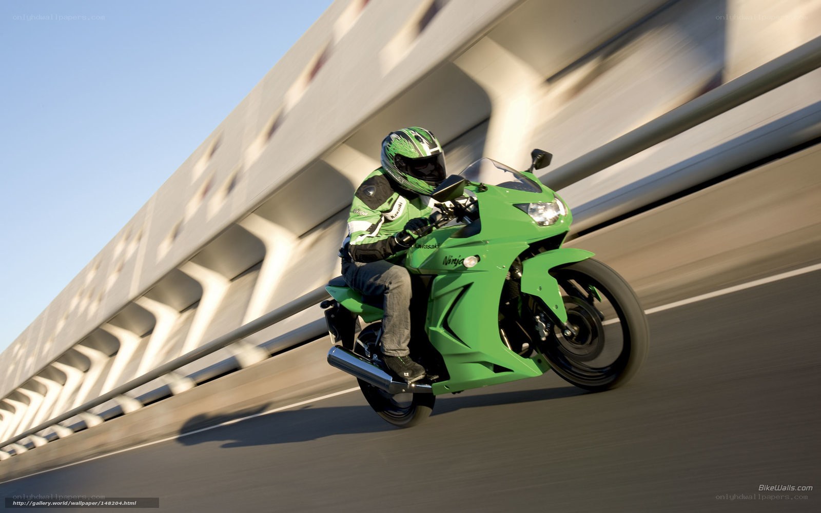 Riding a green motorcycle