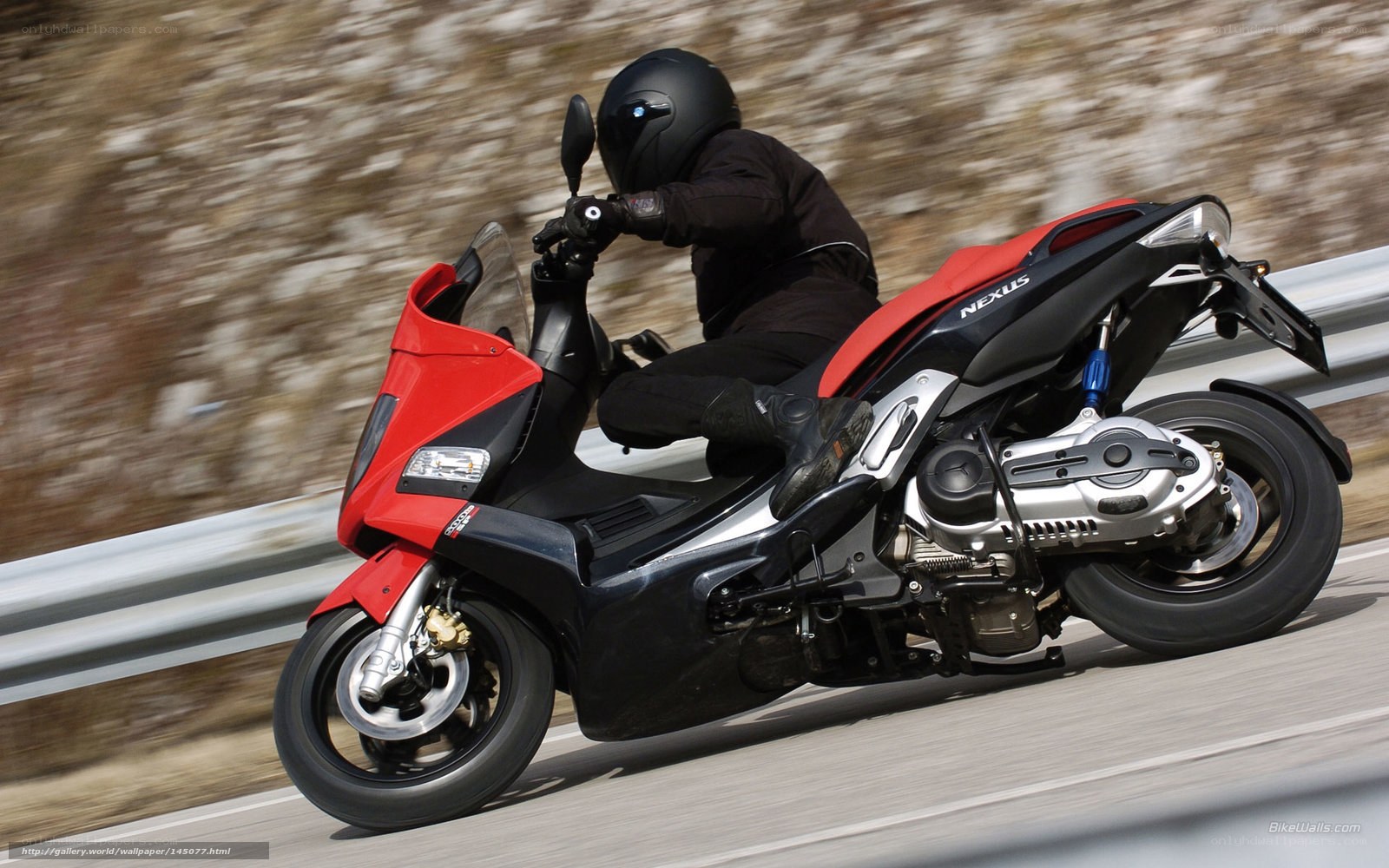 Riding a red scooter on a road