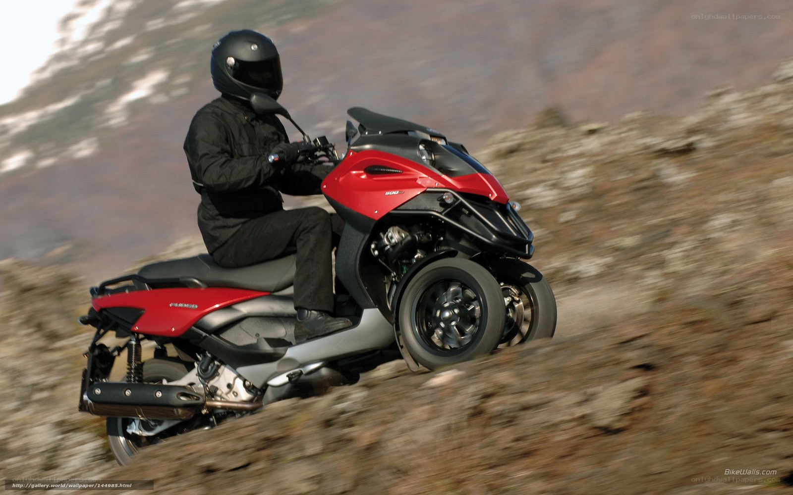 Riding a red three-wheeled scooter