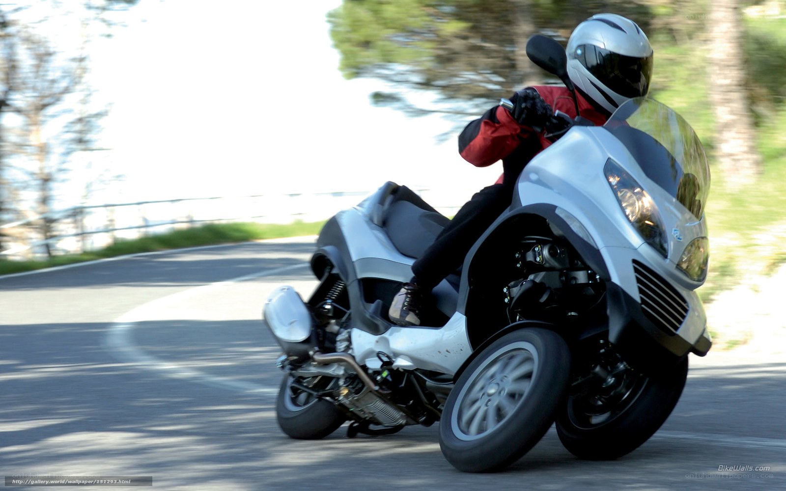 Riding a three-wheeled scooter