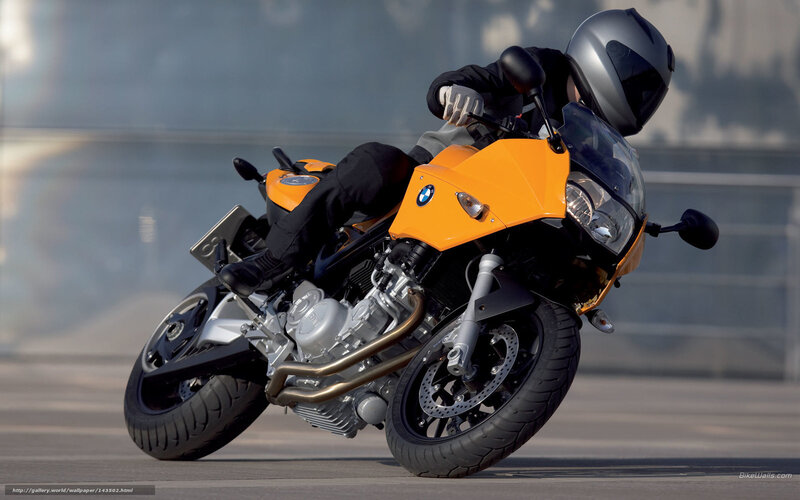 Riding a yellow BMW motorcycle