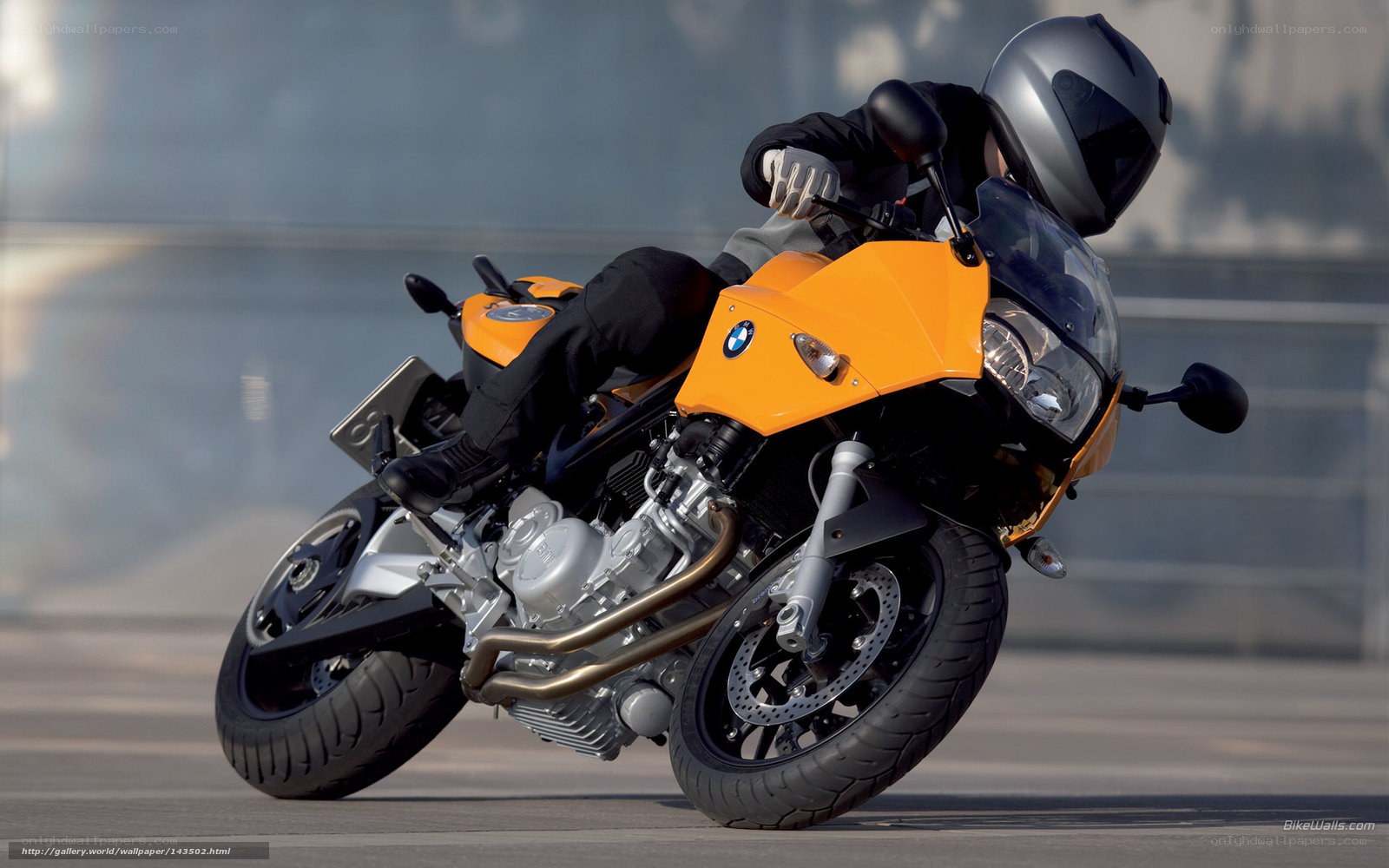 Riding a yellow BMW motorcycle