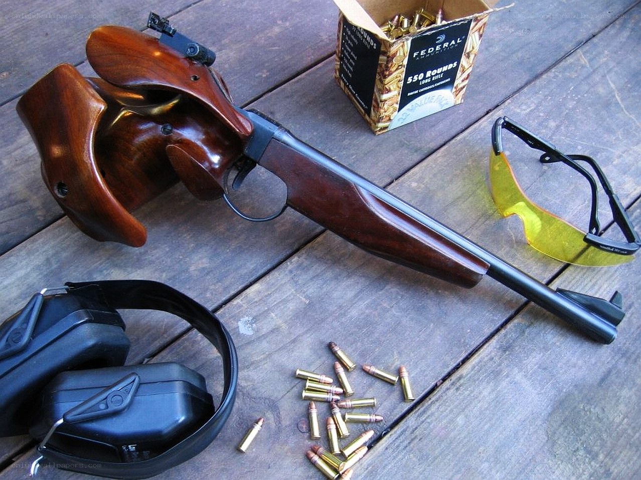 rifle and ammunition on table