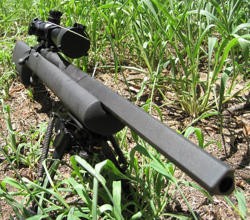 rifle in grass