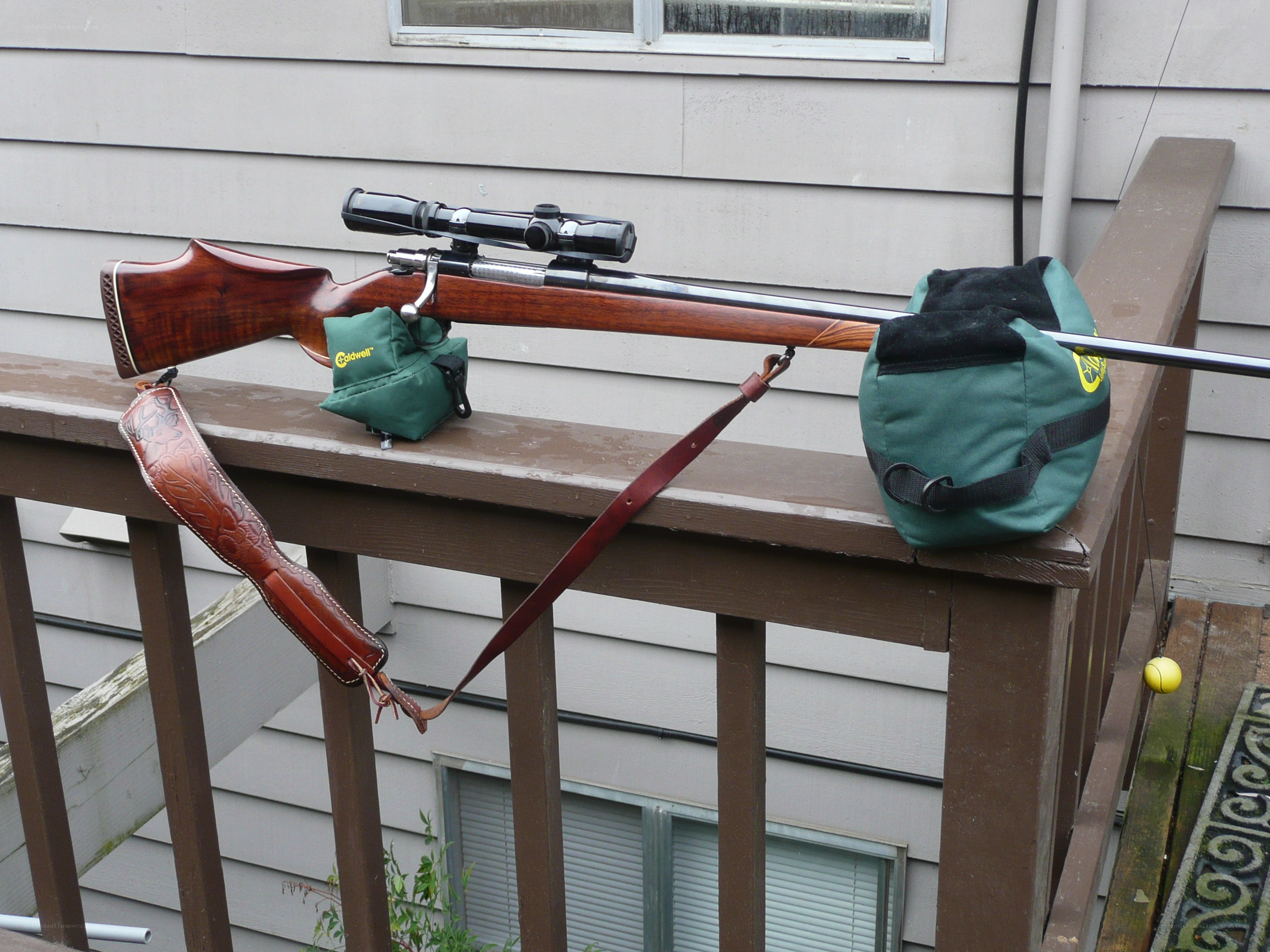 rifle on a deck