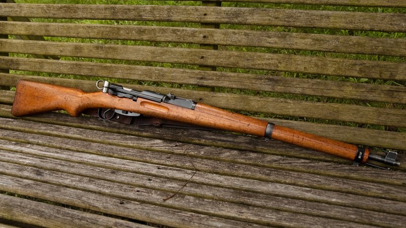 rifle on a wooden bench