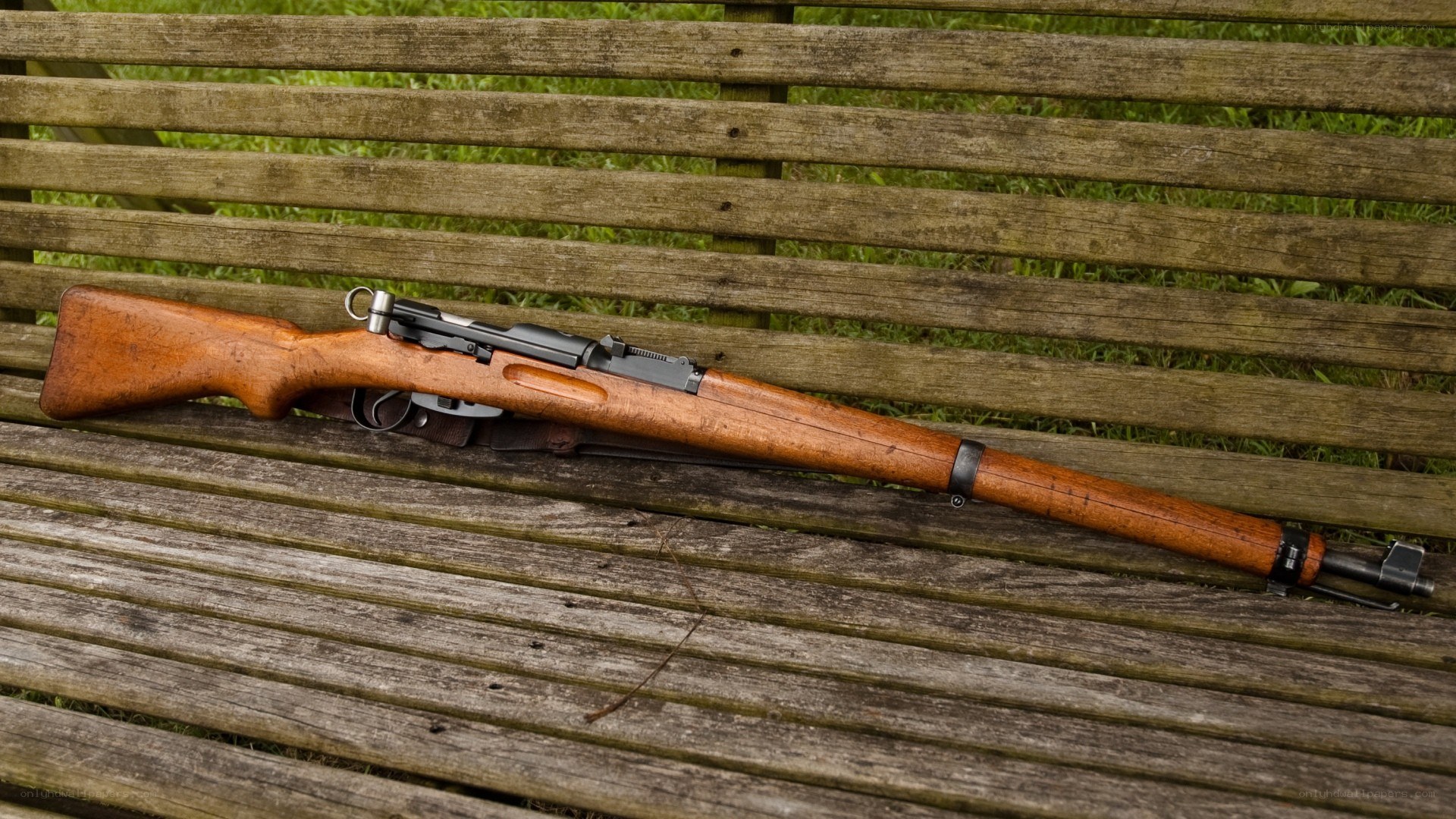 rifle on a wooden bench