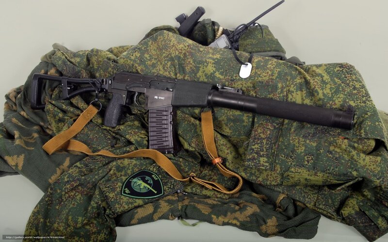 Rifle on Camouflage Gear