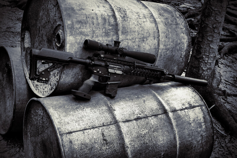 Rifle on Metal Barrels — Black