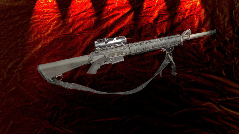 Rifle on Red Fabric
