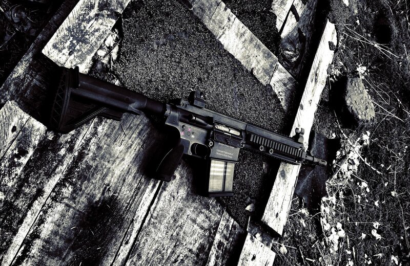 rifle on wooden planks