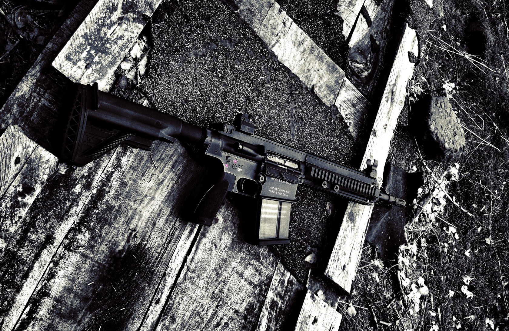 rifle on wooden planks
