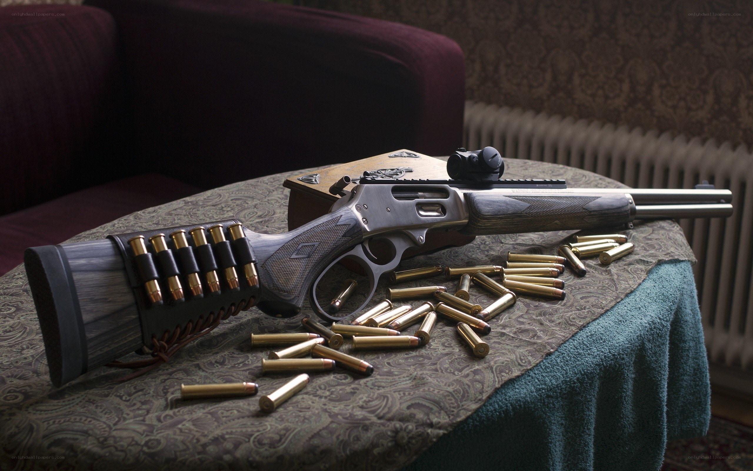 Rifle with ammunition on table