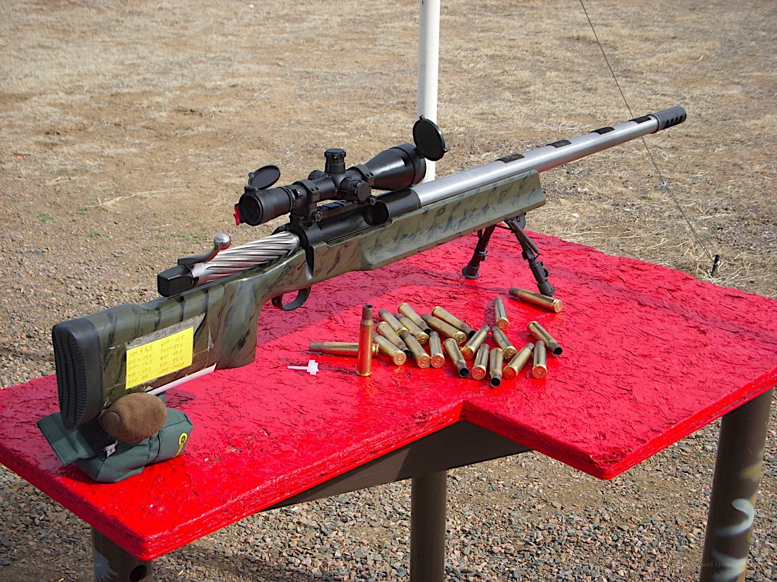 rifle with ammunition on table