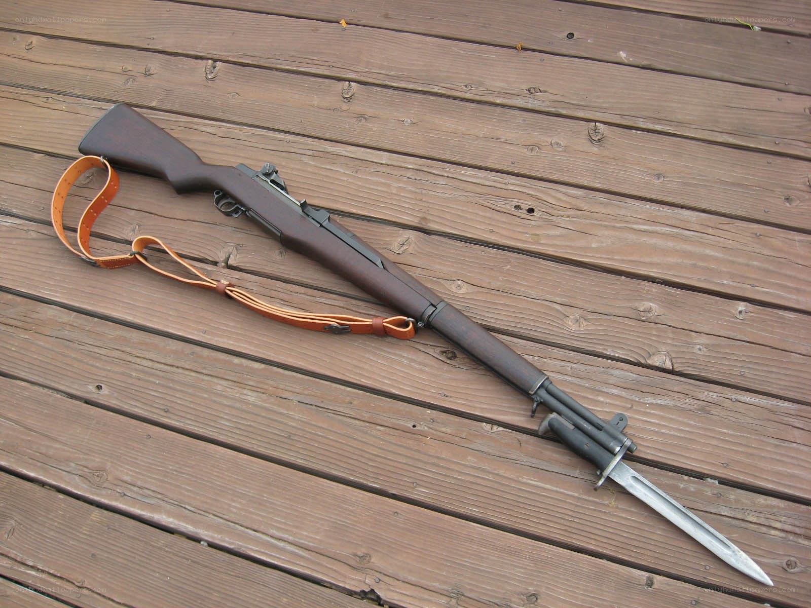 rifle with bayonet on deck