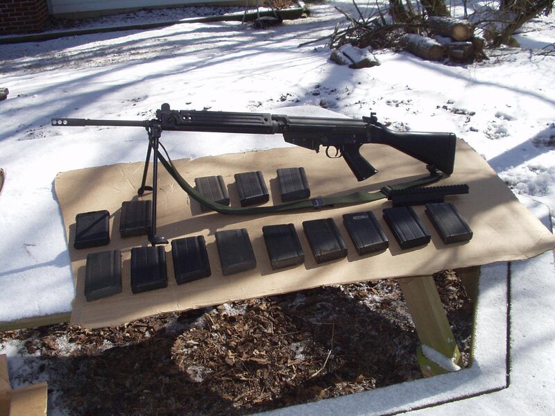 Rifle with magazines on table