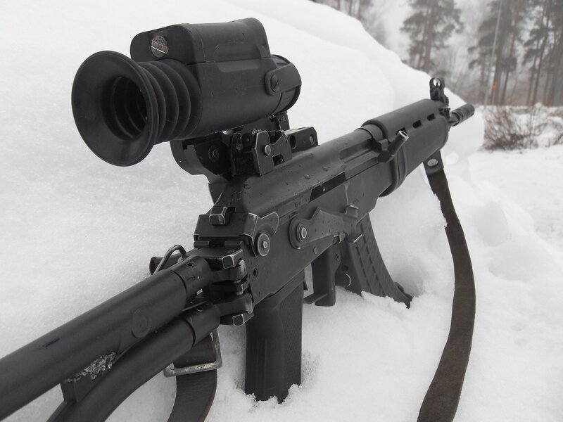 rifle with night vision in snow