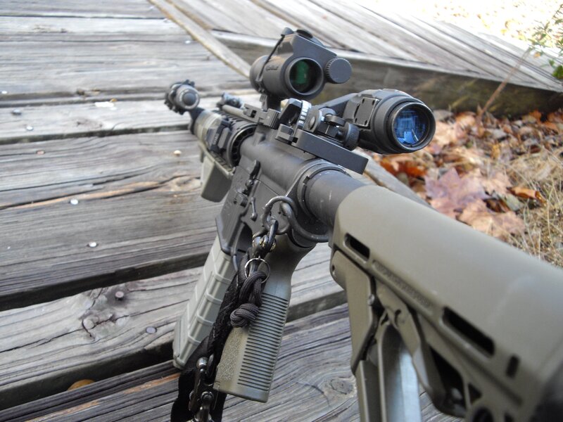 rifle with optics on deck