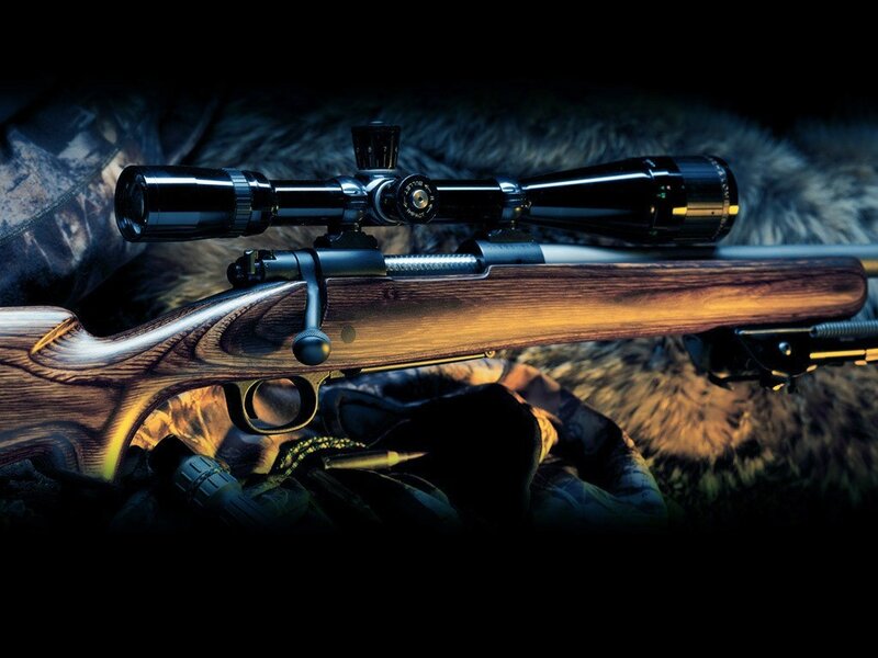 Rifle with scope on fur
