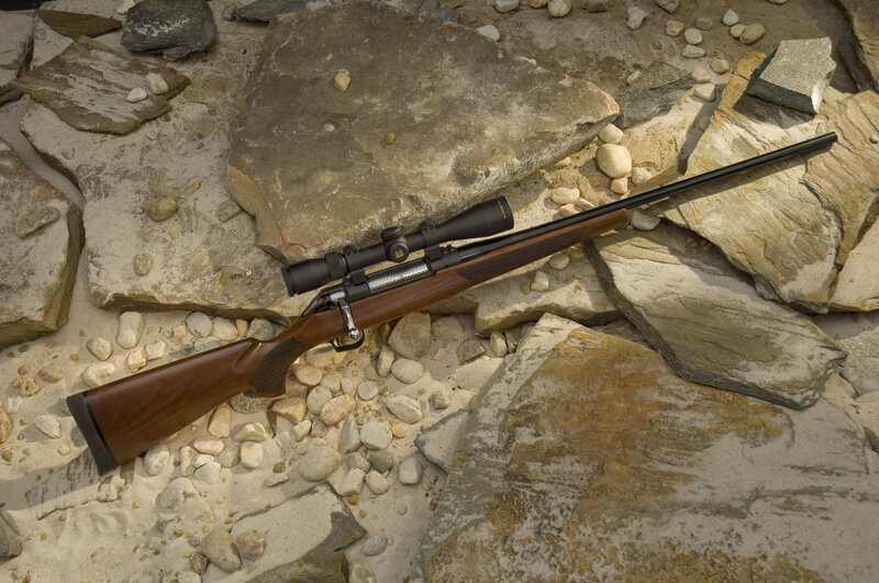 Rifle with Scope on Rocks