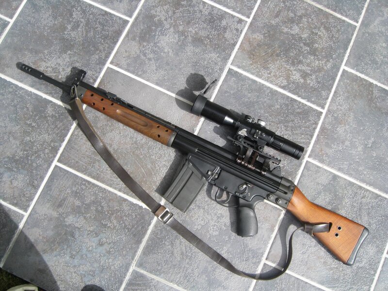 rifle with scope on tile floor