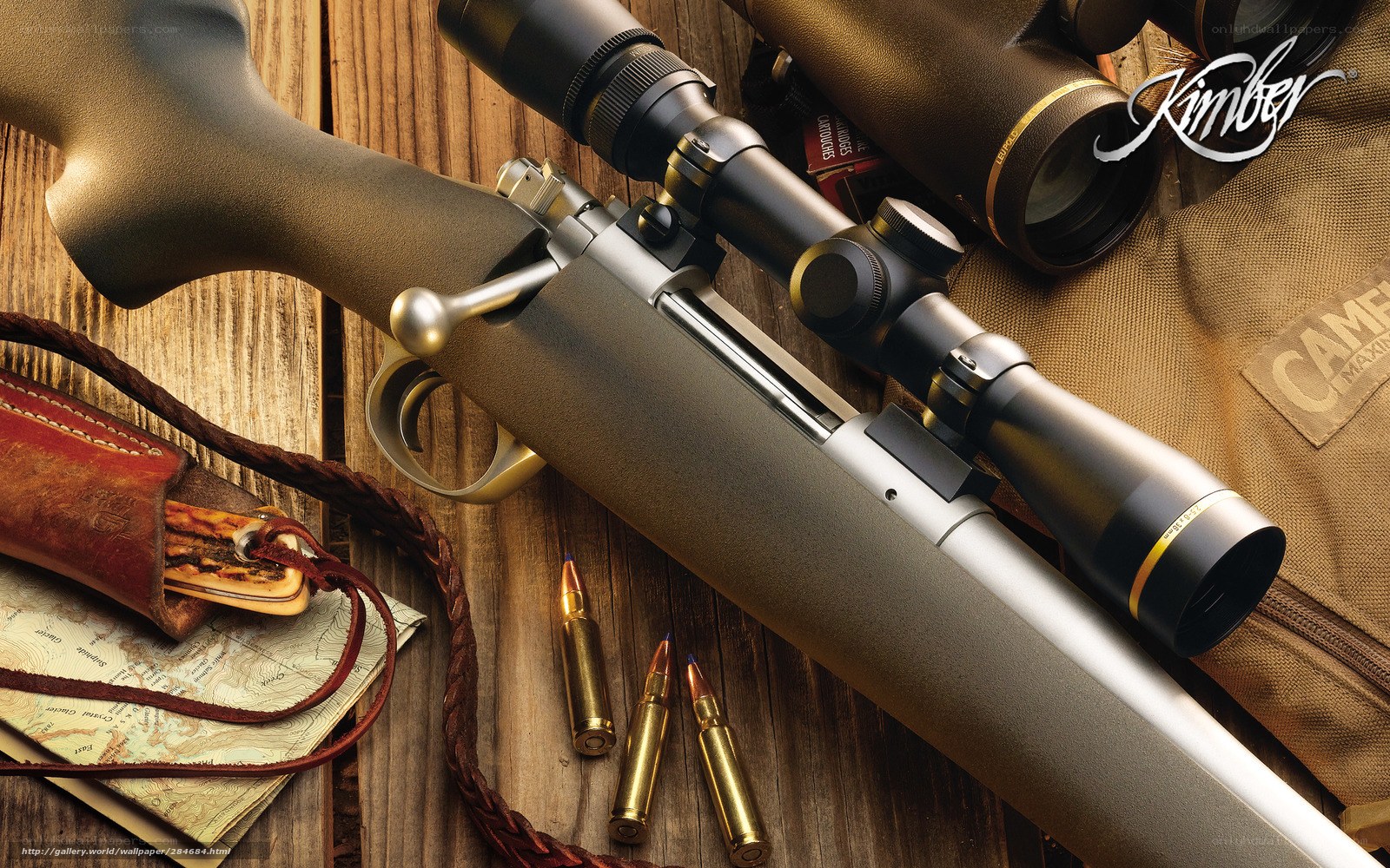Rifle with scope on wood