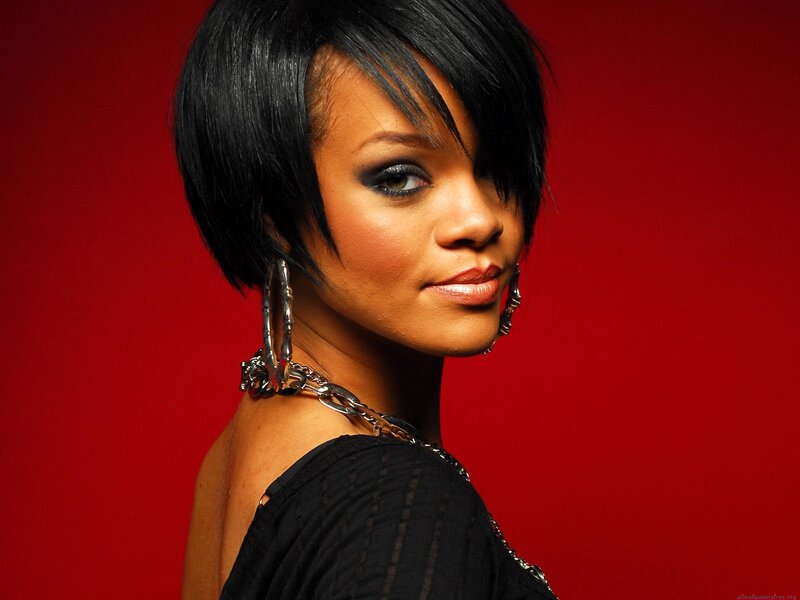 Rihanna in black with red background