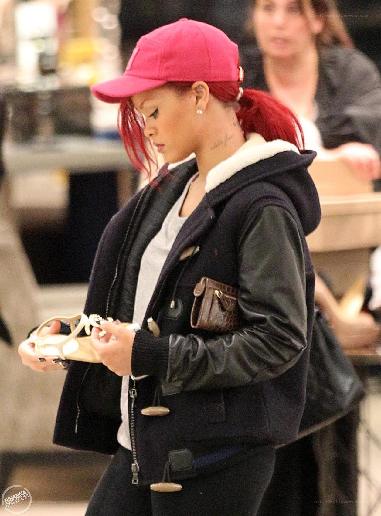 Rihanna in pink cap