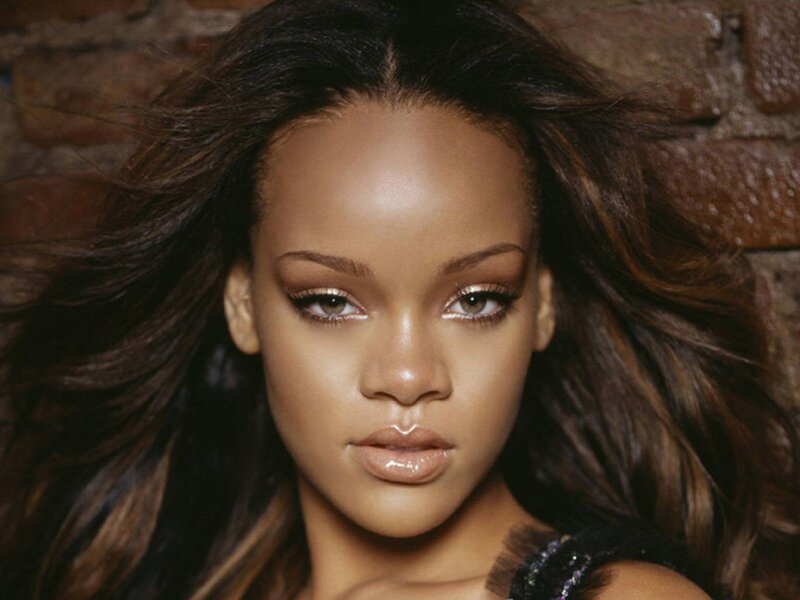 Rihanna portrait against brick wall