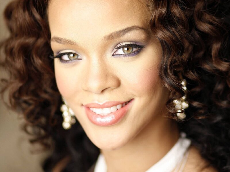 Rihanna with curly hair and makeup