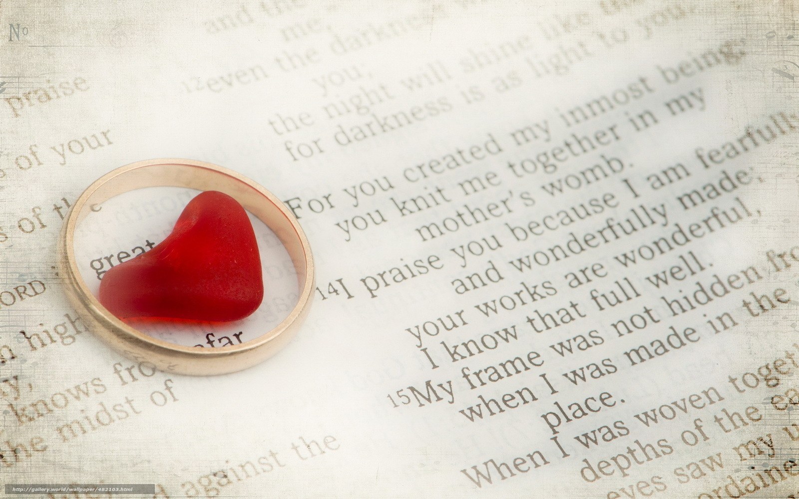 ring with red heart on text