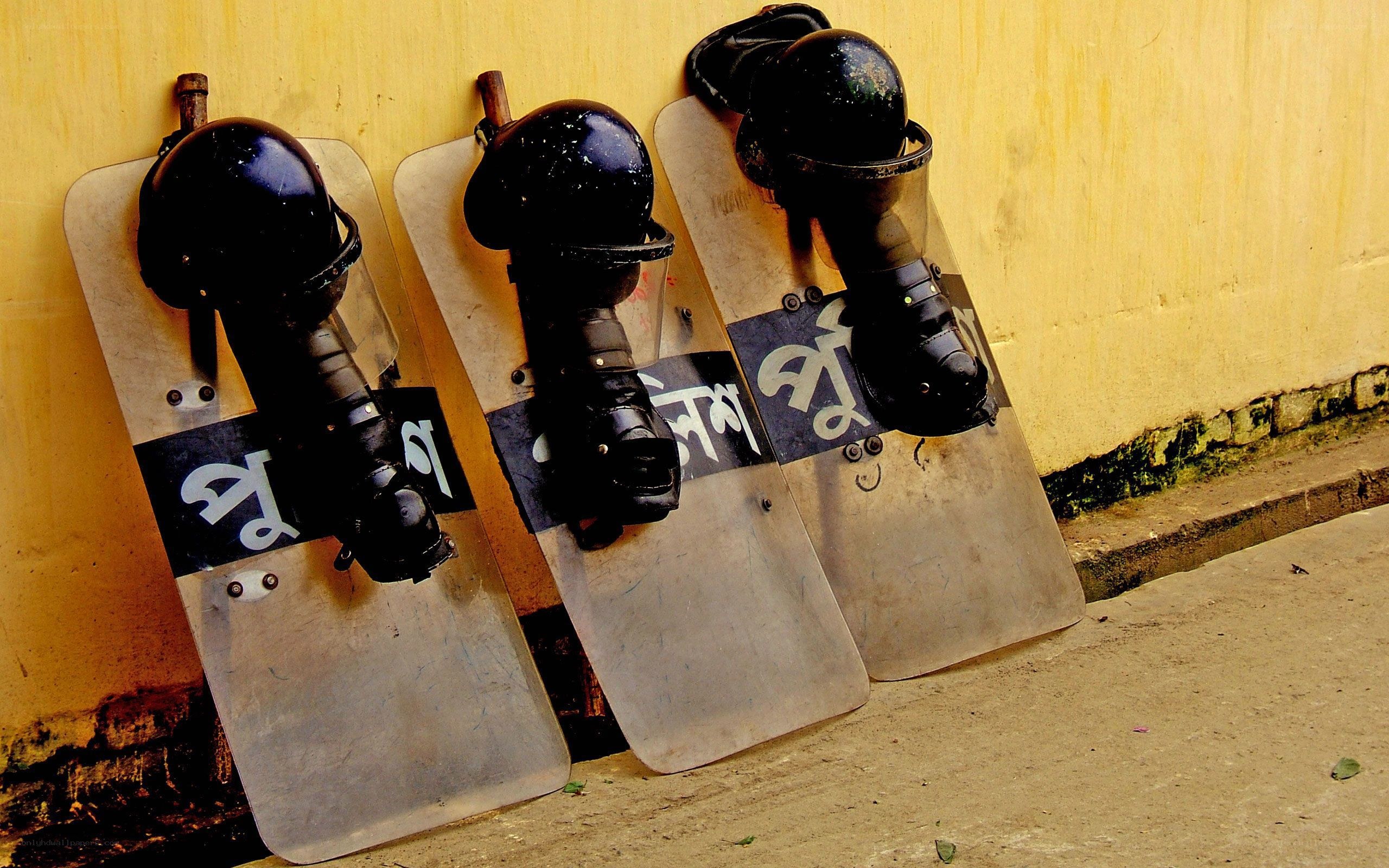 Riot gear against a wall
