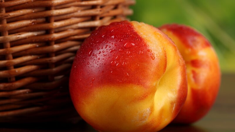 Ripe Peaches in Basket