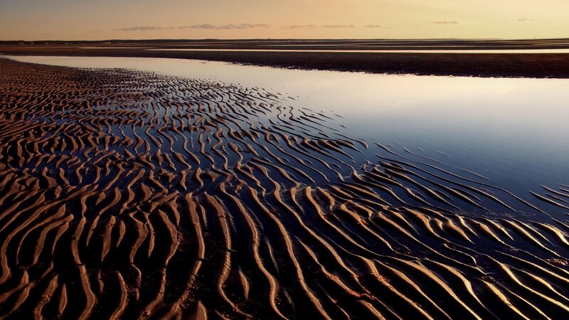 rippled sand at sunset