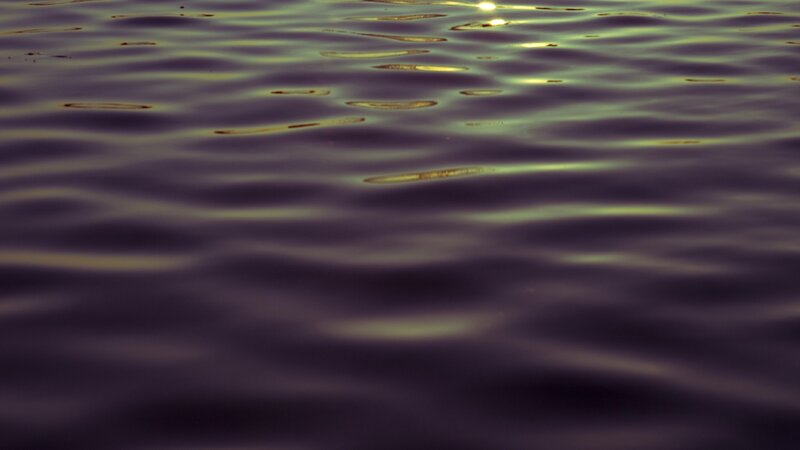 Ripples on water at sunset
