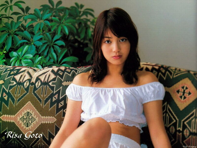 Risa Goto on a patterned couch